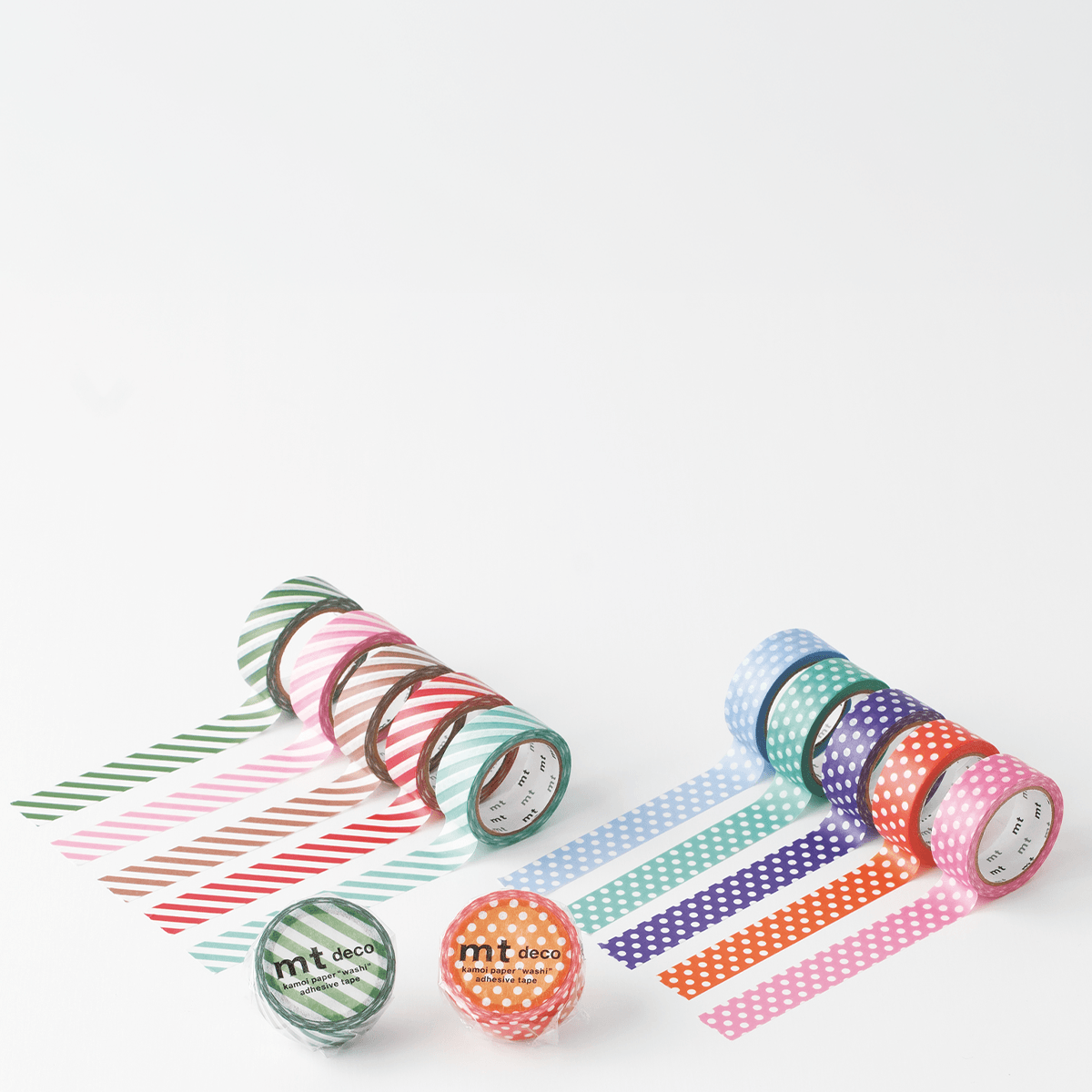 Set of colorful washi tape rolls on a white background
