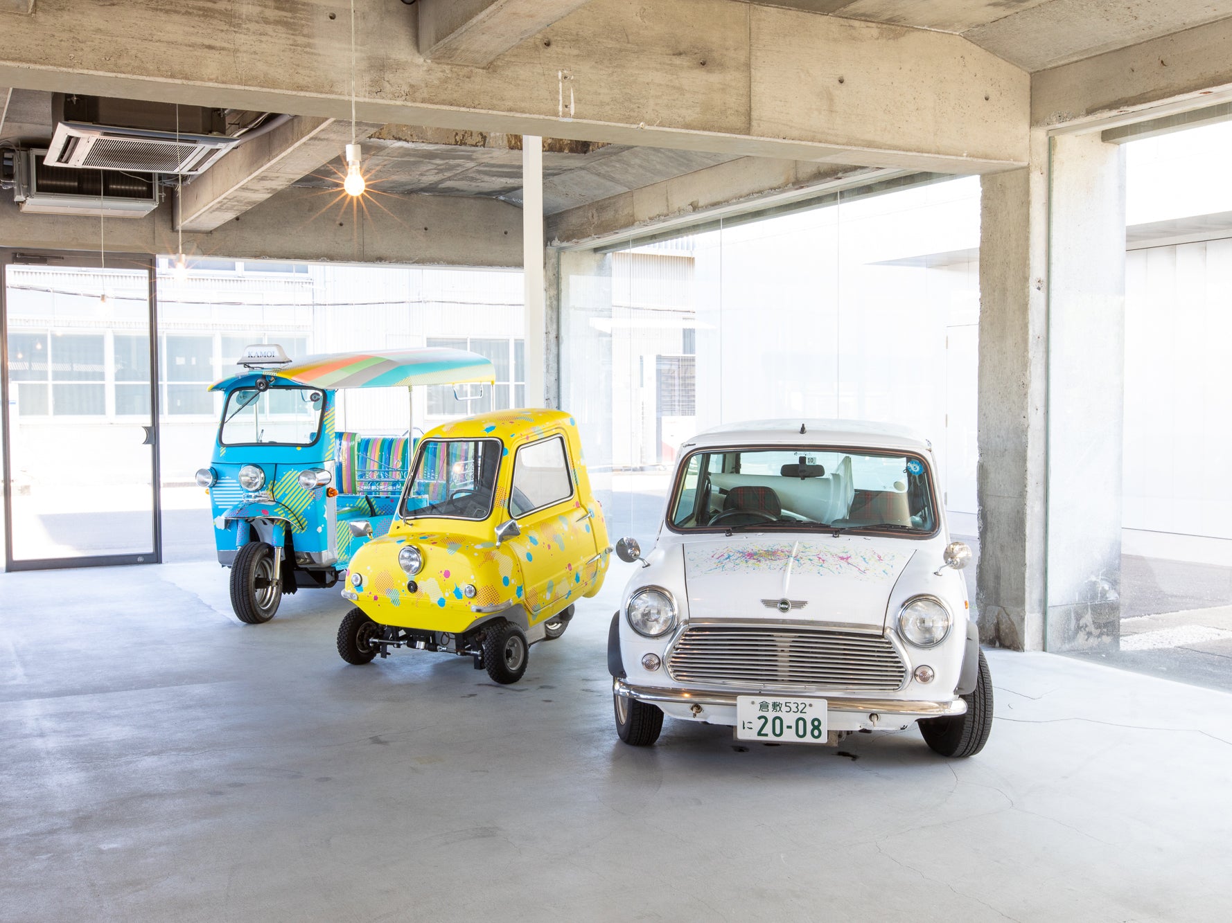 Warehouse with a tuktuk, Japanese bubble car and a MINI decorated in mt 'washi' Masking Tape.